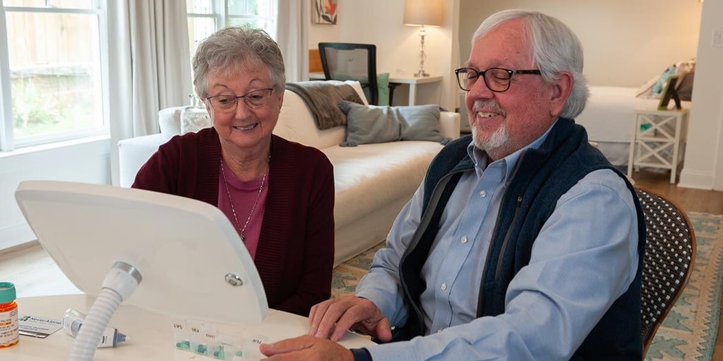 Seniors using Never Alone telehealth tablet device